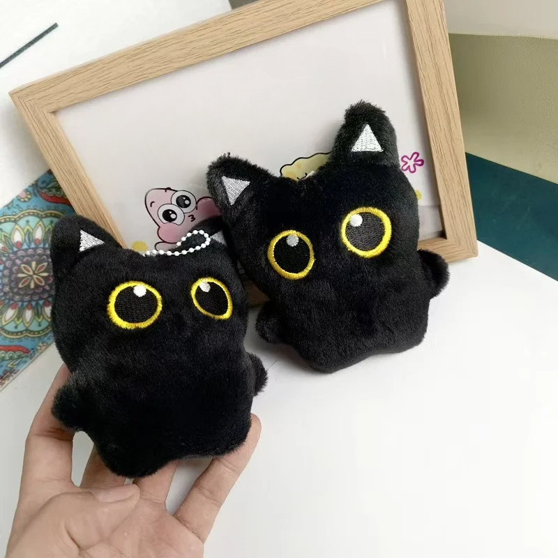 Cute plush toy of a black cat, – Photography Rules Bewertung und Preis